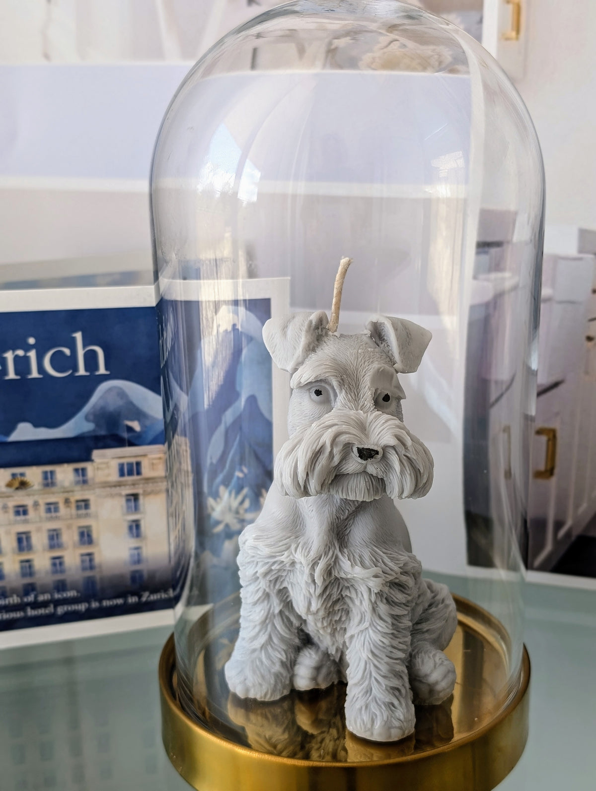 Handmade Schnauzer candle displayed beneath a decorative glass dome by SZOFI & CO