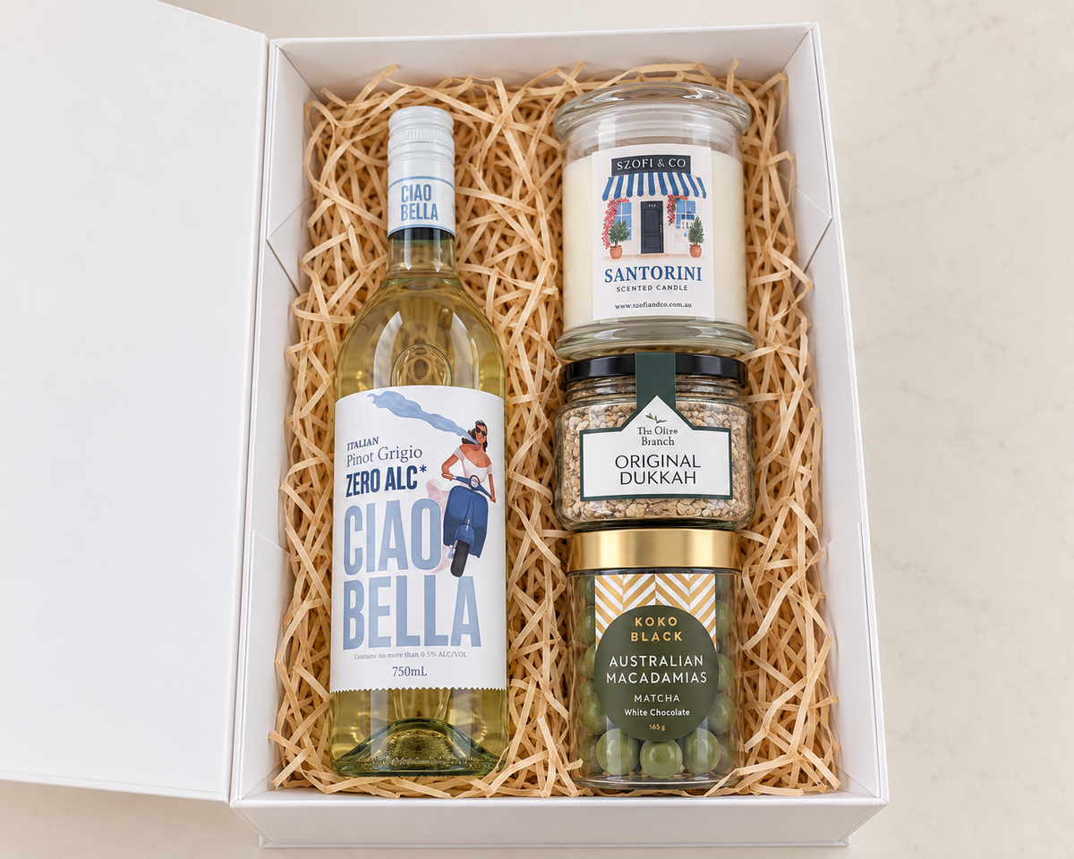 Ciao & Savour gift box with Ciao Bella Zero Alc Pinot Grigio, a large SZOFI & CO candle, Original Dukkah and matcha white chocolate macadamias.