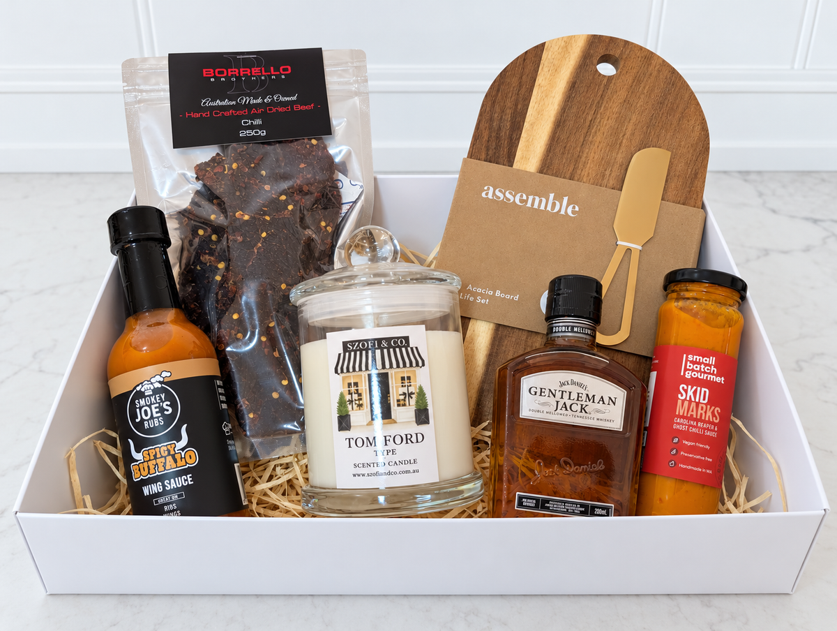 The Ember & Oak Gift Box with Gentleman Jack whiskey, a Large SZOFI & CO candle, chilli jerky, two sauces and acacia board set