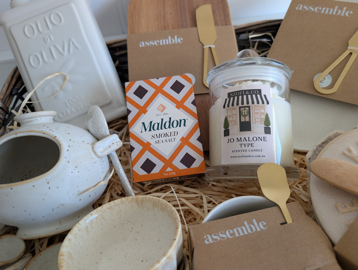 Original close-up of the Large SZOFI & CO candle, Maldon smoked sea salt and ceramic kitchenware