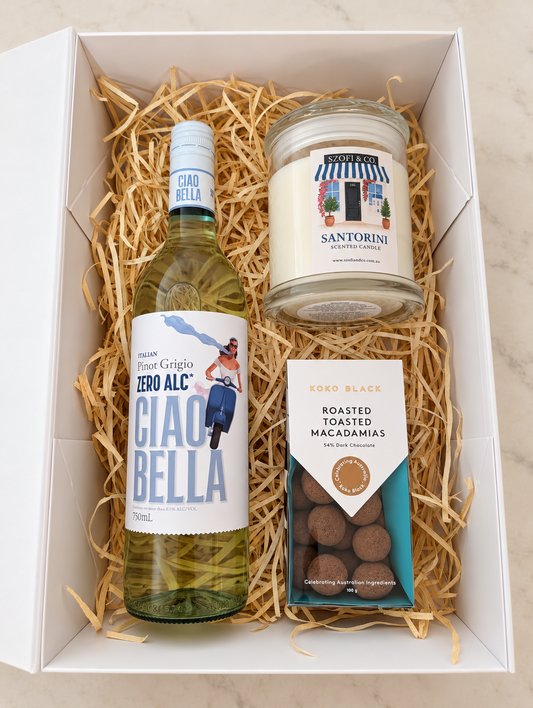 Ciao & Candlelight gift box with Ciao Bella Zero Alc Pinot Grigio, a large SZOFI & CO candle and Koko Black dark chocolate macadamias.