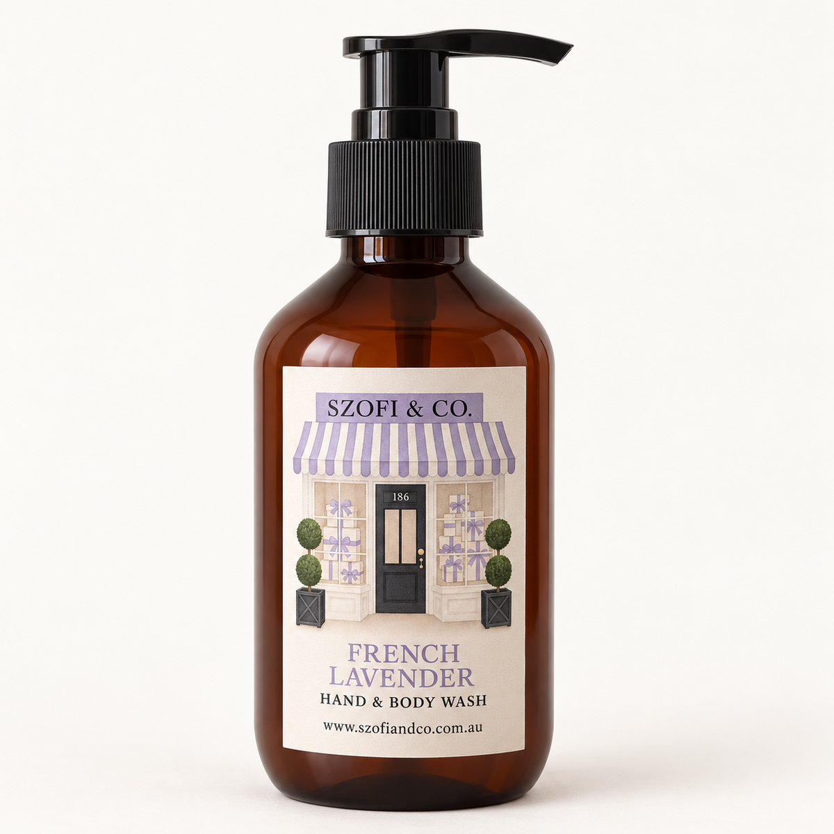 SZOFI & CO French Lavender Hand & Body Wash in an amber pump bottle on a warm ivory background