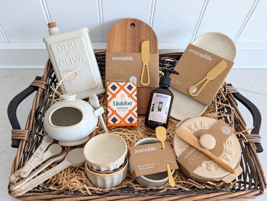 The Welcome Home Hamper in a willow tray with ceramic kitchenware, acacia serving board and SZOFI & CO hand & body wash