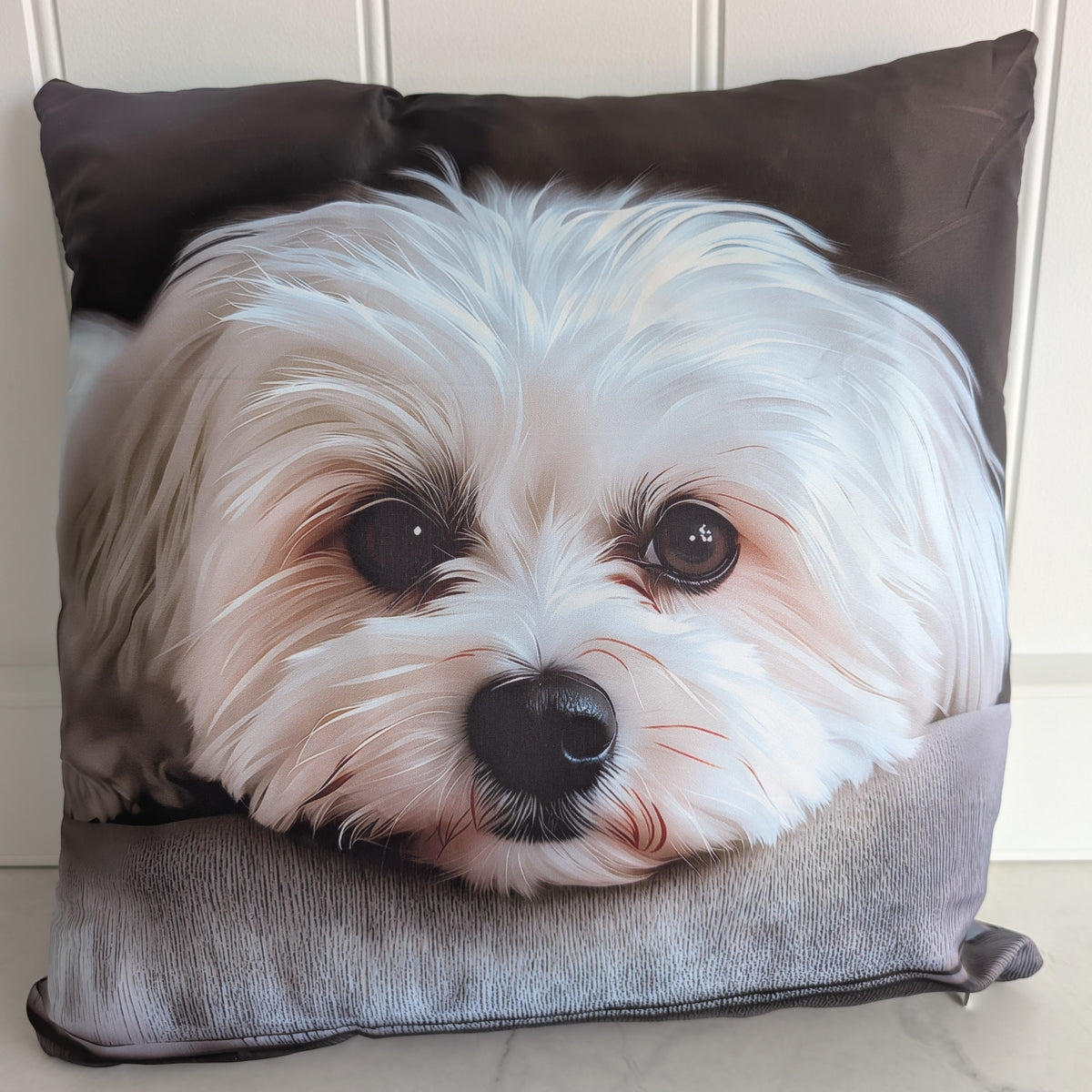 White puppy portrait cushion, looking towards the camera, front view